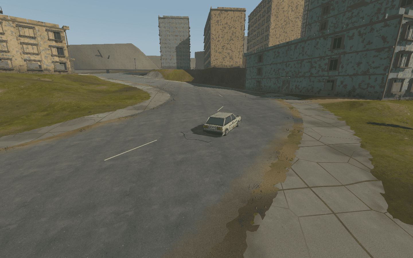 Weathered car rounding a bend between city buildings