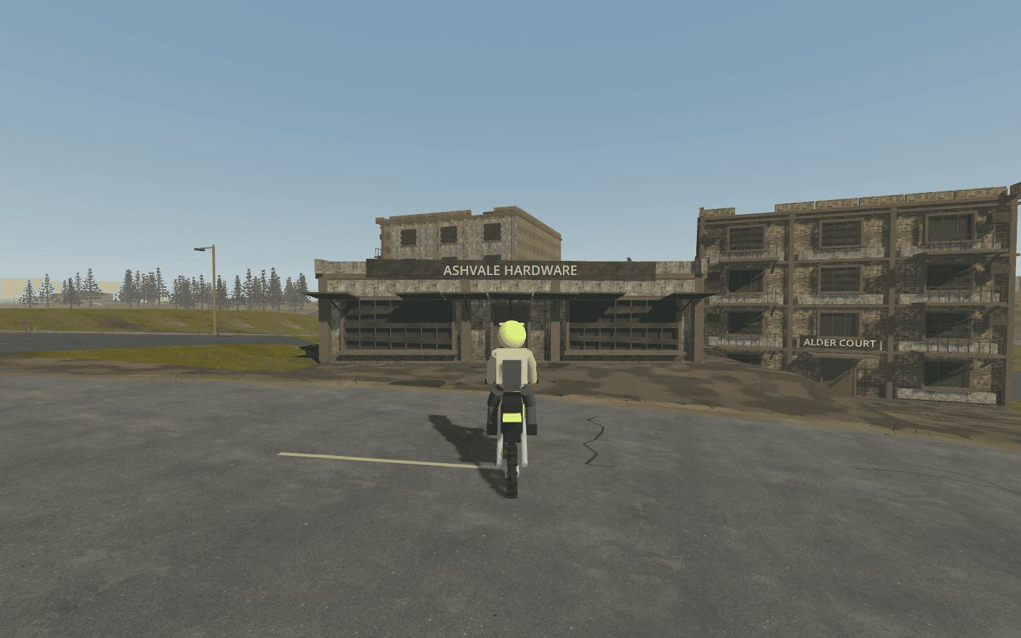Riding view of weathered shops and apartments beside paved town frontage